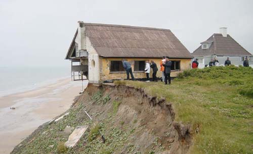 Photograph Of A House Falling Off A Cliff Due To Erosion House Falling Off Cliff