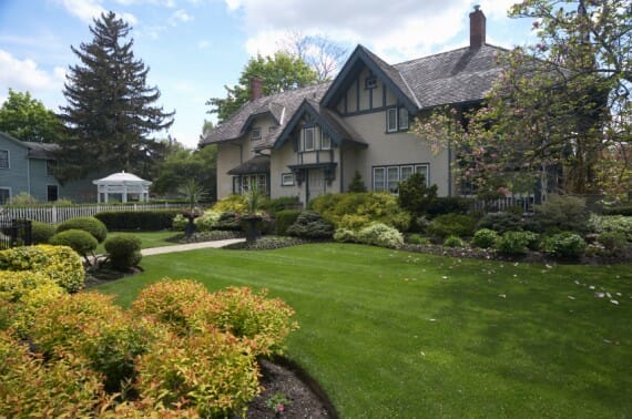 House With Beautiful Lawn and Shrubs